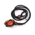 Detail of hand-woven black cord necklace with raw reddish stone and wood beads - Red Jasper