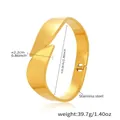 Detail showing 2.2cm wide stainless steel gold cuff bracelet with dimensions and weight - Cross Overlapping Cone Open Bracelet (Z531) / Gold