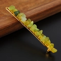 Detail of green crystal stones hand-wrapped with gold wire on a sleek long hair clip - Korean Jade + Gold Clip