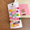 Set of 10 colorful jelly-colored luminous snap hair clips for girls on wood background - Colorful Square