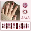 Short red press-on nails with heart designs and marble patterns in 24-piece full set - Red and White Heart Marble Style (A648) / Glue Type