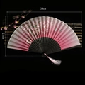 Pink gradient Chinese folding fan with cherry blossoms and black hollow bamboo frame - Spirit of the Waves