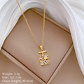 Detailed view of gold perfume bottle pendant with sparkling white cubic zirconia stones - Perfume Bottle Style (C245)