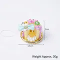 Simpatico portachiavi a torta di panna in PVC rosa con kiwi e dettaglio fiocco - Fiocco blu con cinturino rosa