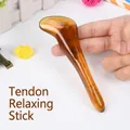 Amber-colored resin Gua Sha massage stick with ergonomic S-curve and swirl texture - Tendon Stick / Amber