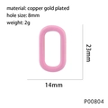 Detail view of pink oval copper charm showing 23x14mm size and 8mm hole diameter - Pink