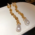 Detail of golden leaf earrings with shimmering rhinestones and teardrop pearl drops - 6# Ear Clip Golden Leaf Pearl