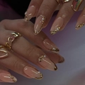 Short almond press-on nails in nude jelly color with gold wire outlines and pearl accents - Bz1417 Melodious Charm / Glue Type