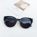 Occhiali da sole cat-eye neri da donna con lenti grigie scure e finitura lucida - Nero e Grigio