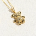 Golden teddy bear pendant necklace set with shimmering white and black cubic zirconia stones - Black Zirconia