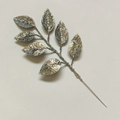 Close-up of artificial silver glitter leaves branch for DIY Christmas tree decoration - Silver
