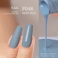 Dual plant-based nail polish in Mist Blue with matte and glossy finish effects - F048 Misty Blue