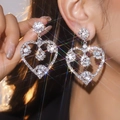 Sparkling silver heart-shaped long tassel earrings with pavé rhinestones on model - Silver Hollow Heart Full Rhinestone Style (DTE1516025S-W)