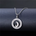 Detail of a stainless steel circle pendant with sparkling crystals and star-moon cutout - NZ14 Star Moon Hollow