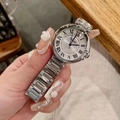 Detail of silver ladies watch featuring Roman numerals and a metallic chain strap - Women's White Dial No Calendar / Silver/White