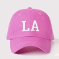 Close-up of high-quality white L.A embroidery on a rose pink cotton baseball cap - One Size / Hot Pink