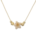 Minimalist gold beaded necklace featuring a white ceramic star pendant on white background - Copper and Earthy Yellow Star