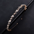 Sparkling floral rhinestone bridal headband with gold alloy leaves and crystal flower design - KC Gold