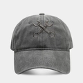 Close-up of cross-wrench embroidery and washed cotton texture on vintage baseball cap - Adjustable / Gray