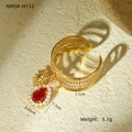 Macro view of gold adjustable ring with red gemstone drop and tiny pearl border - Hollow Woven Red Stone Artificial Pearl Pendant Style (NMSR-H112-1)