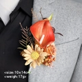 Handmade orange calla lily boutonniere with yellow daisies on a grey suit lapel - Caramel Orange