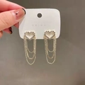 Orecchini pendenti a nappa dorata con cuori scintillanti impreziositi da strass - Nappa a cuore con strass / Oro