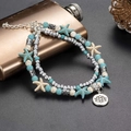 Bohemian multilayer beaded anklet with blue starfish and silver lotus charm - Lotus