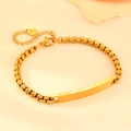Polished gold stainless steel rectangular bar bracelet with round links on beige background - Gold Style (N311)