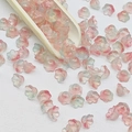 Top view of 7x12mm pink and blue gradient lily of the valley glass beads for DIY jewelry - Lily of the Valley 27# Bud Green 7x12mm