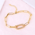 Detail of gold-plated paperclip chain bracelet with a clear zircon oval centerpiece - Oval Gold Bracelet