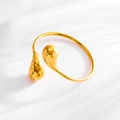 Detailed close-up of 18K gold-plated stainless steel cuff with unique teardrop texture - Hollow Lattice / Gold