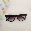 Kids black cat-eye sunglasses with purple gradient lenses on soft white plush background - Black Frame Double Gray Lens