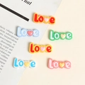 Close-up of resin 'Love' letter charms with heart details for DIY craft accessories - Love (Small)