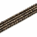 Macro detail of faceted pyrite beads showing metallic luster and precise cut texture - 10mm / Electroplated Coffee