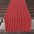 Festive red table runner with white polka dots draped over an antique wooden table - 33*183cm / Red Polka Dot