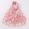 Thick warm pink scarf with tassels featuring soft texture and minimalist aesthetic - Light Pink