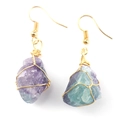 Detail of handmade gold wire wrapped raw purple and green fluorite crystal drop earrings - Gold + Fluorite