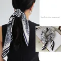 Blue and white paisley print satin scarf used as an elegant hair tie for ponytail - New Cashew Square / 65