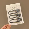 Lot de 3 barrettes Y2K en métal argenté présentées sur carte, environ 6 cm de longueur - Pince Bec de Canard Ovale (M3-067) / 6cm