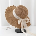 Detailed view of wide-brim straw hat featuring delicate white lace ribbon and bow decoration - V-Hollow Lace Bow / Khaki