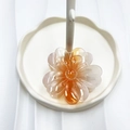 Translucent orange gradient flower hair claw clip displayed on a white tray - Orange (Transparent Lucky Flower)