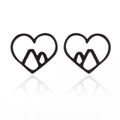 Detail view of matte black heart-shaped studs featuring a geometric mountain silhouette design - 150 Black