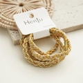 Detailed macro view of three braided yellow hair ties on a branded display card - Yellow Multi-color