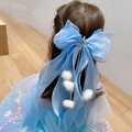 Blue organza bow hair clip with snowflake gem and white fur balls on hair - 1235 Blue Hairball