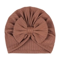 Detailed close-up of brown ribbed fabric baby hat featuring a large decorative bow - Brown