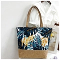Canvas tote bag with blue tropical leaves and brown linen splice detail on shoulder strap - Blue Yellow Small Leaf