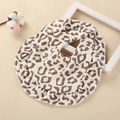 Detail of baby cotton bib with leopard print, ruffled edges and white snap fastener - Leopard Print