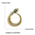 Tabella delle dimensioni di una spilla a serpente con gemma verde e strass su sfondo bianco - Serpente Oro/Gemma Verde
