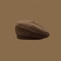 Detailed close-up of brown knit beret hat texture with Skull Studio logo detail - Basic Style/No Decor / Plain Coffee