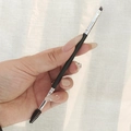 Dual-ended eyebrow brush with angled bristles and spiral spoolie with a black handle - No. 14 Eyelash + Brow Brush